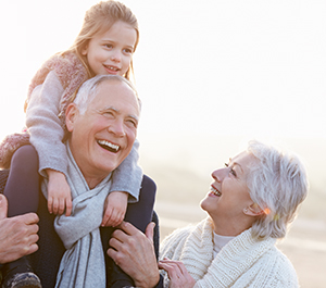 Grandparents on a walk with grandchild