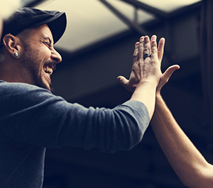 Friends give each other a high-five
