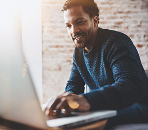 Man searches online for the benefits of a money market account