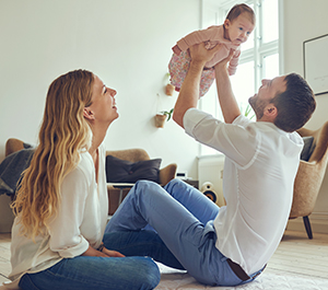 Parents play with baby