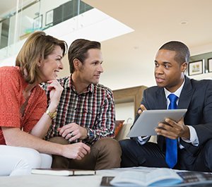 Couple meeting with their financial advisor to discuss tips for investing during volatile markets