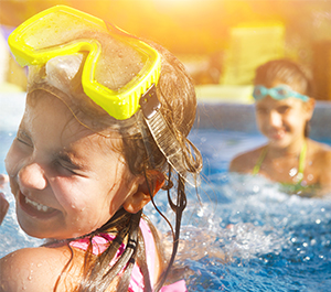 Kids splash in the swimming pool