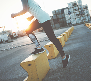 Athlete walks up step during workout
